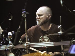 Black-and-white photograph of Gary Moffatt at the drums