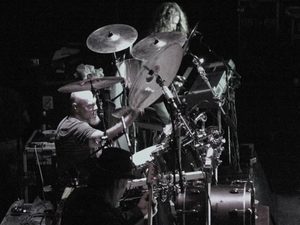 Black-and-white view of Gary Moffatt behind his cymbals