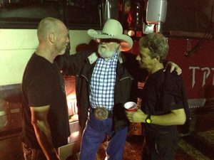 Gary Moffatt talking with fellow musicians backstage